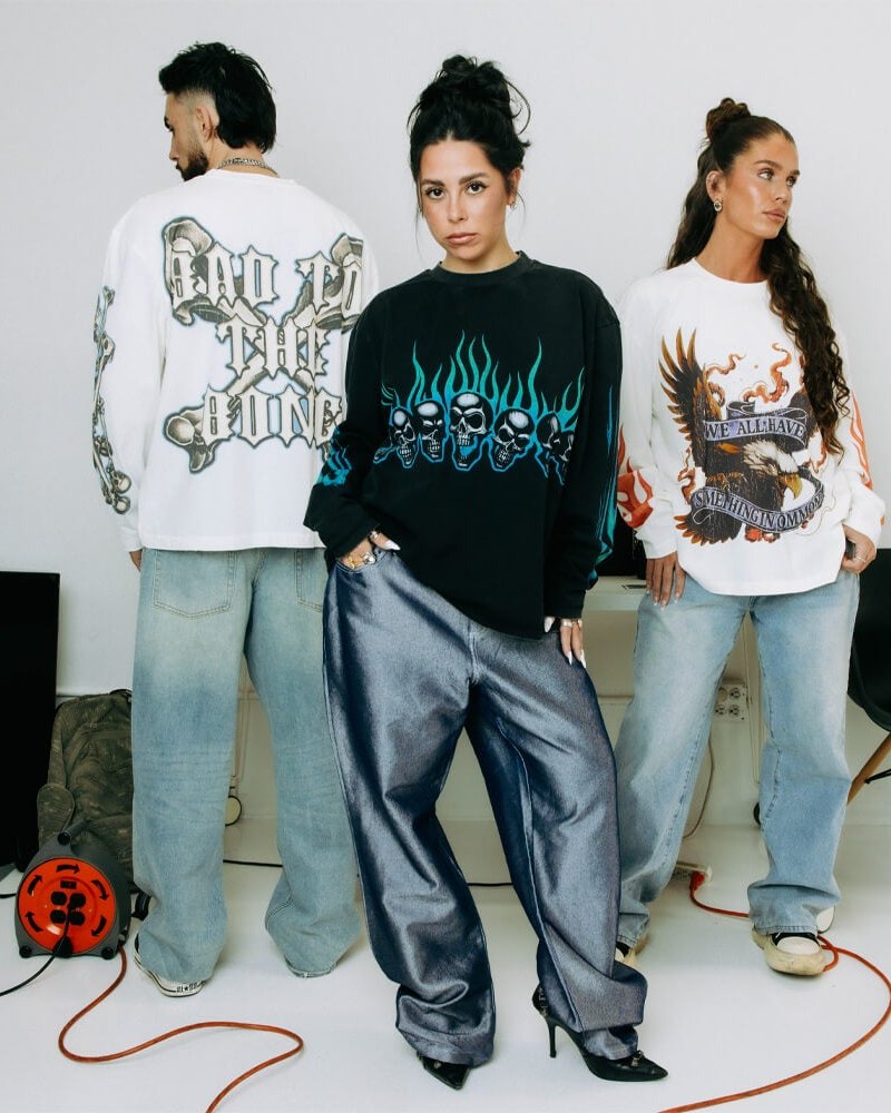 Three Commons Studios models wearing graphic streetwear in the brand's campaign photo.